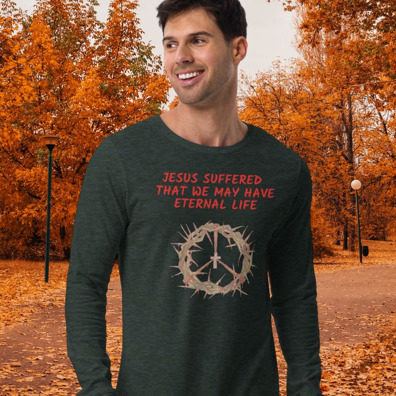 White man wearing a black Christian long-sleeve shirt that says "Jesus suffered that we may have eternal life".
Below the text, there. is a graphic of a crown of thorns, with a cross in the middle. The crown of thorns was what Jesus wore on his head during the Crucifixion.