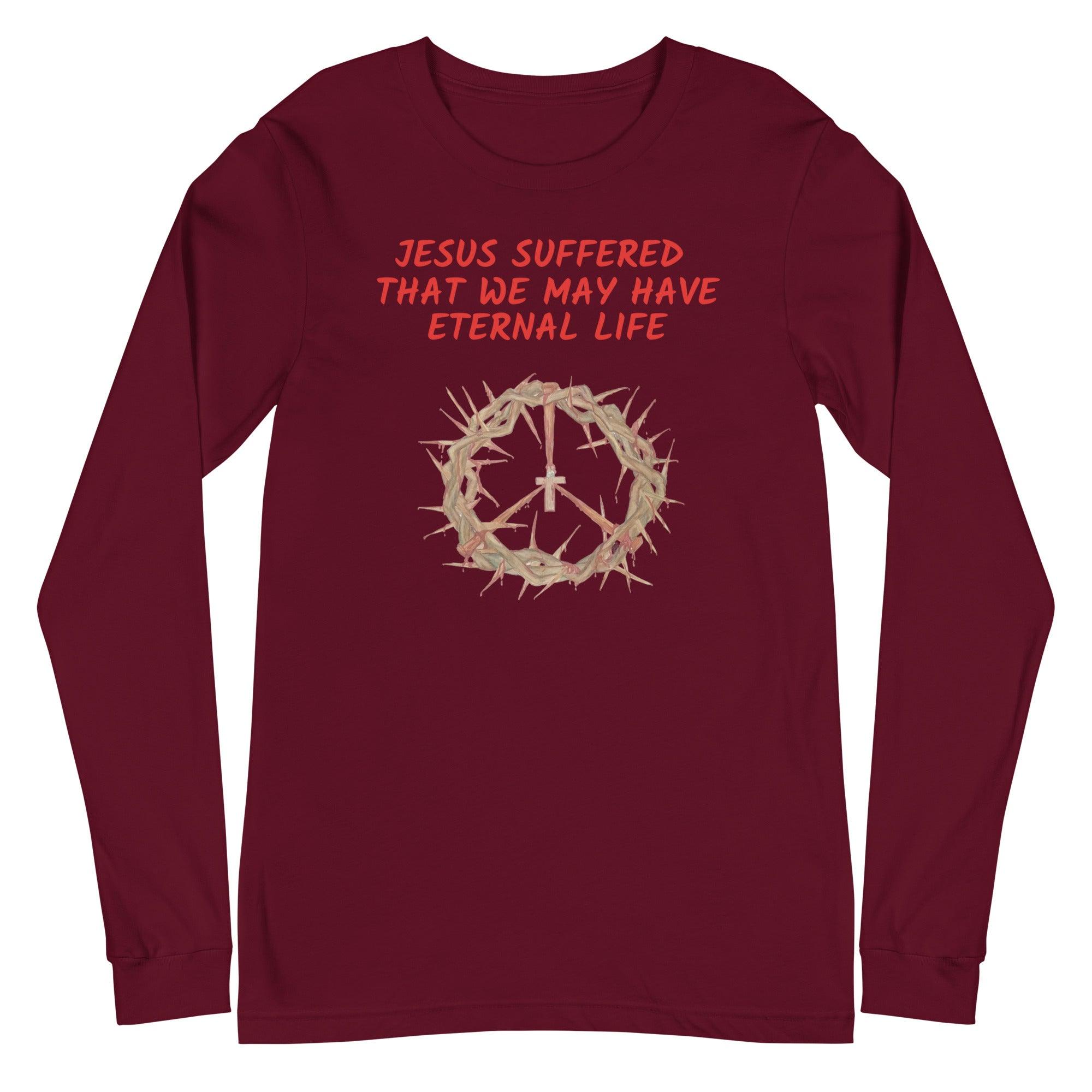 Flatlay of a maroon Christian long-sleeve shirt that says "Jesus suffered that we may have eternal life".
Below the text, there. is a graphic of a crown of thorns, with a cross in the middle. The crown of thorns was what Jesus wore on his head during the Crucifixion.