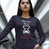 Hispanic woman wearing a navy Christian shirt. The shirt has a large hourglass icon in the middle. Above the hourglass, text says "The Last Hour" and below the hourglass, it says "Time is Running Out".