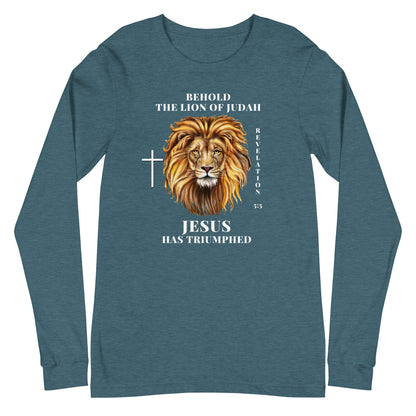Flatlay of a a teal Christian shirt that says &quot;Behold the lion of Judah&quot;. Below the text, there is a graphic of a lion, with a cross icon next to it, and &quot;Revelation 5:5&quot;. On the bottom, text says &quot;JESUS has triumphed&quot;